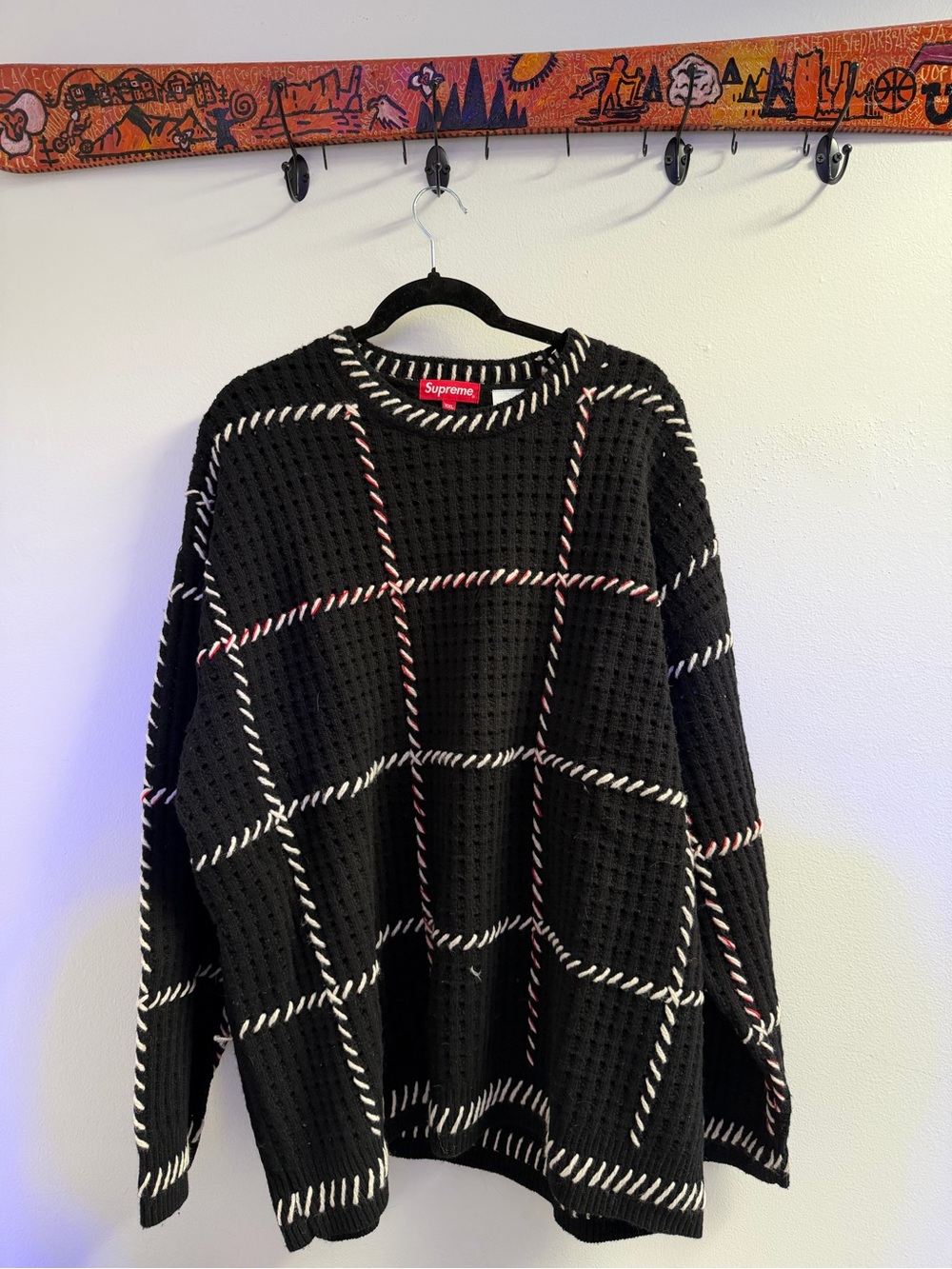 Supreme Black Crewneck Sweater with White and Red Grid